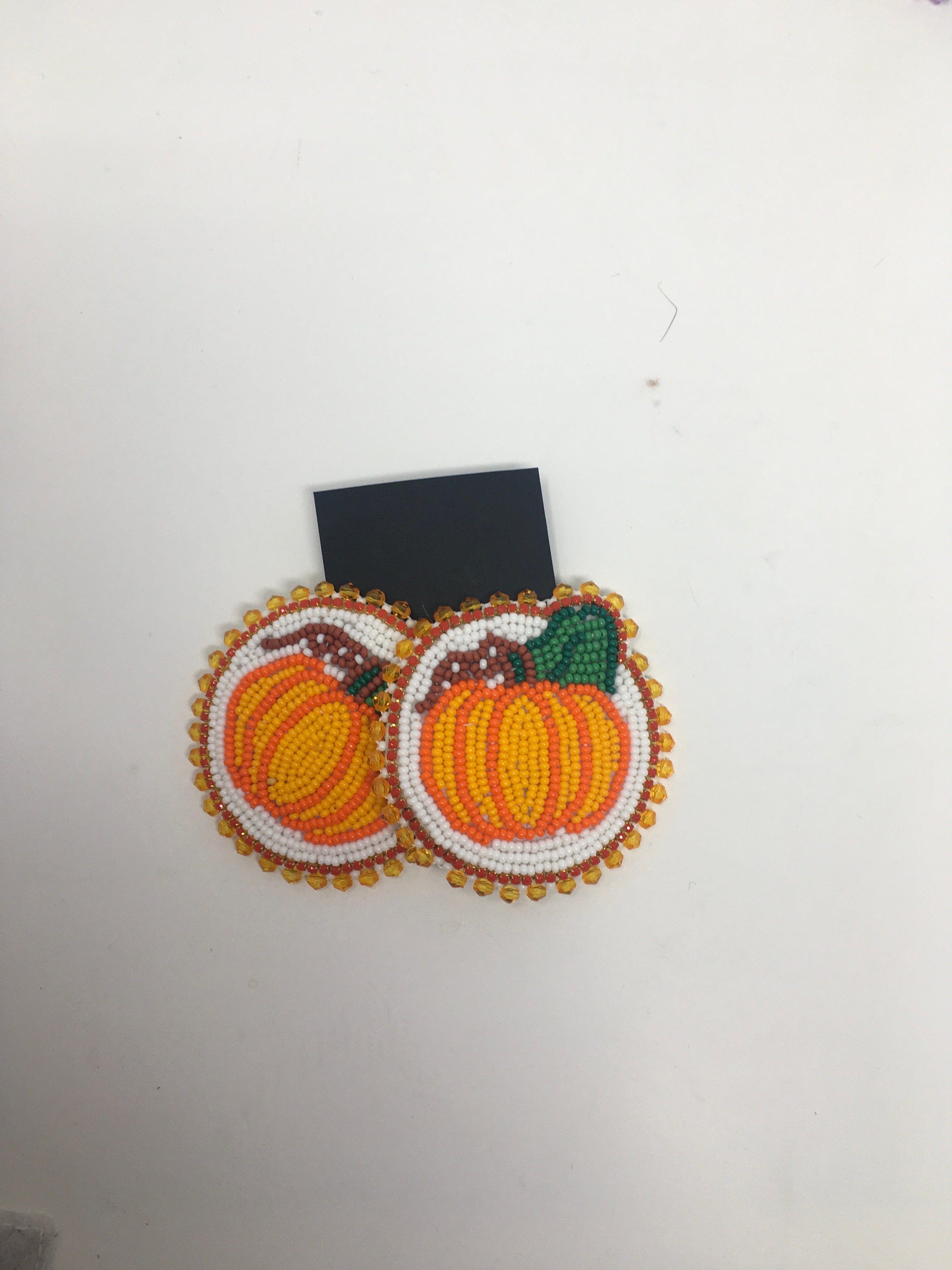 Sunny Poloz beaded pumpkin medallion earrings