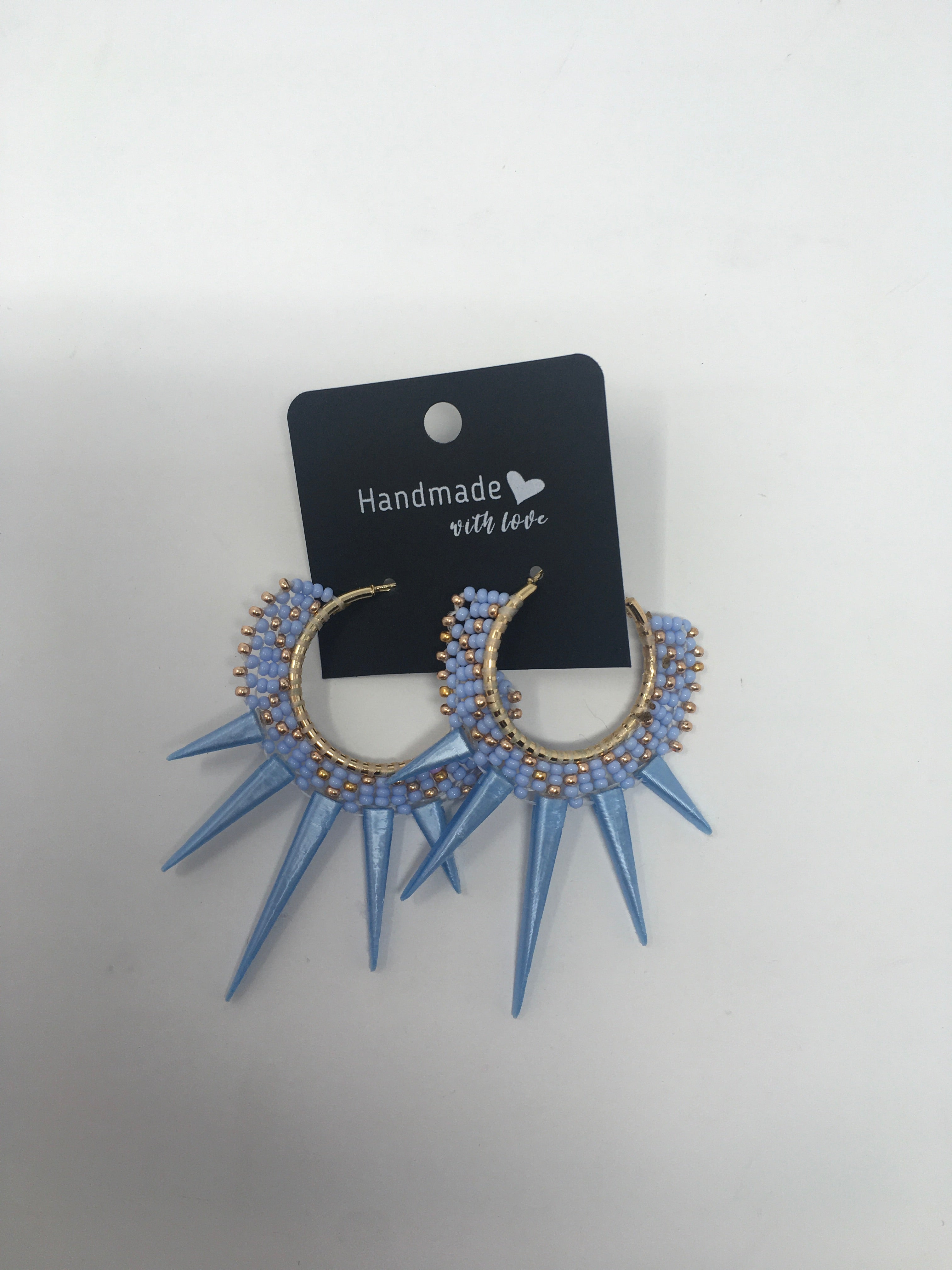 Sunny Poloz blue beaded hoops with blue spike dangles