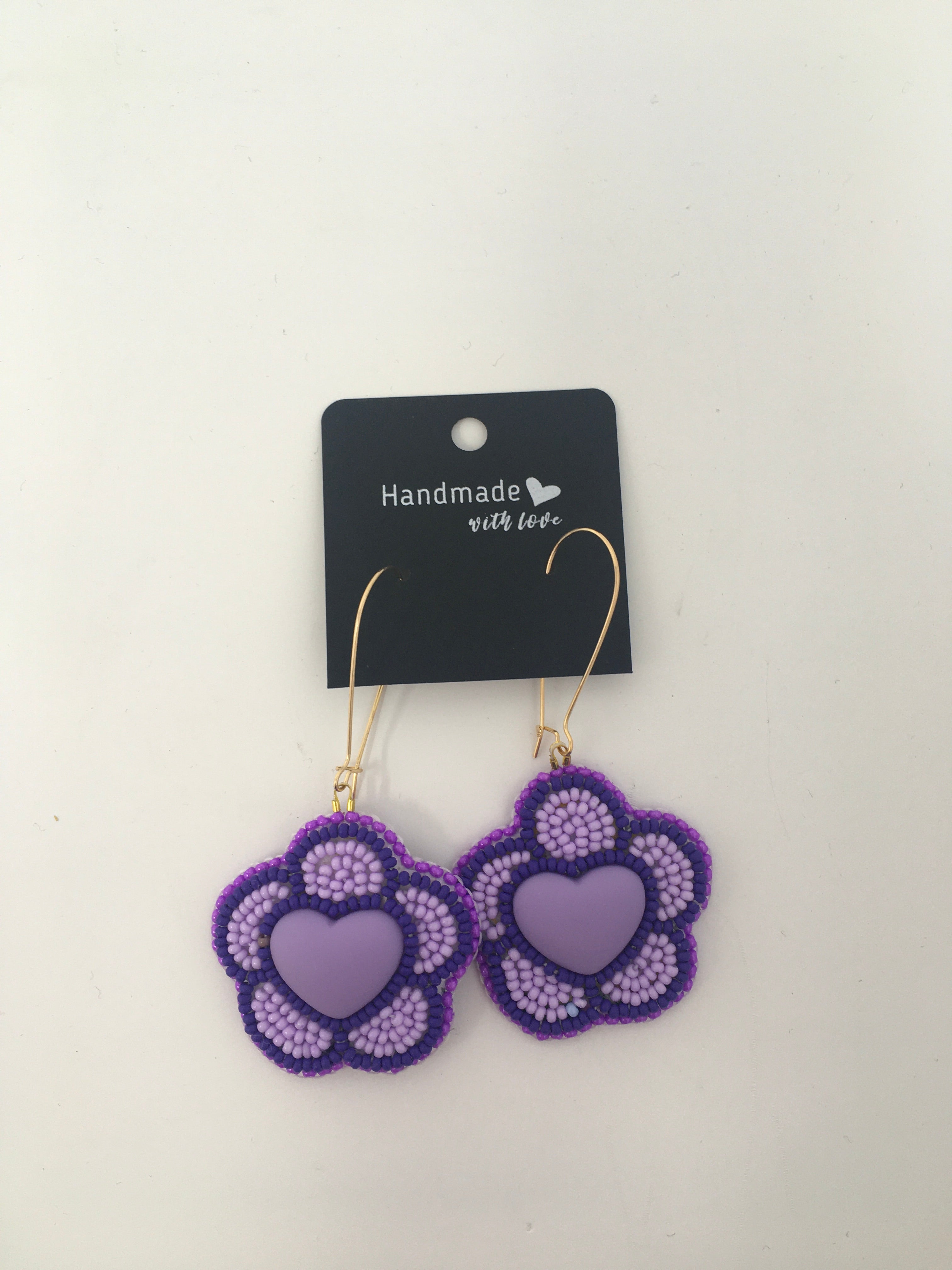 Sunny Poloz  purple flower with heart center dangle